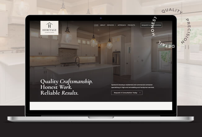 A laptop displaying the website for Heritage Homescapes featuring a modern kitchen image and text promoting quality craftsmanship, honest work, and reliable results.