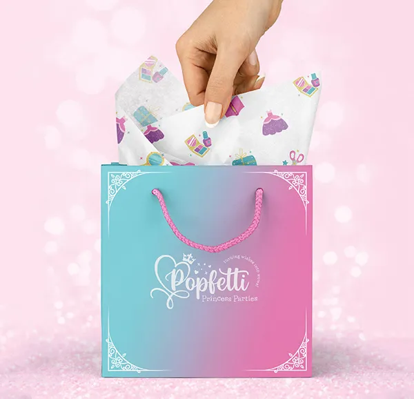Branded gift bag and tissue paper for a princess character company for Popfetti Princess parties.