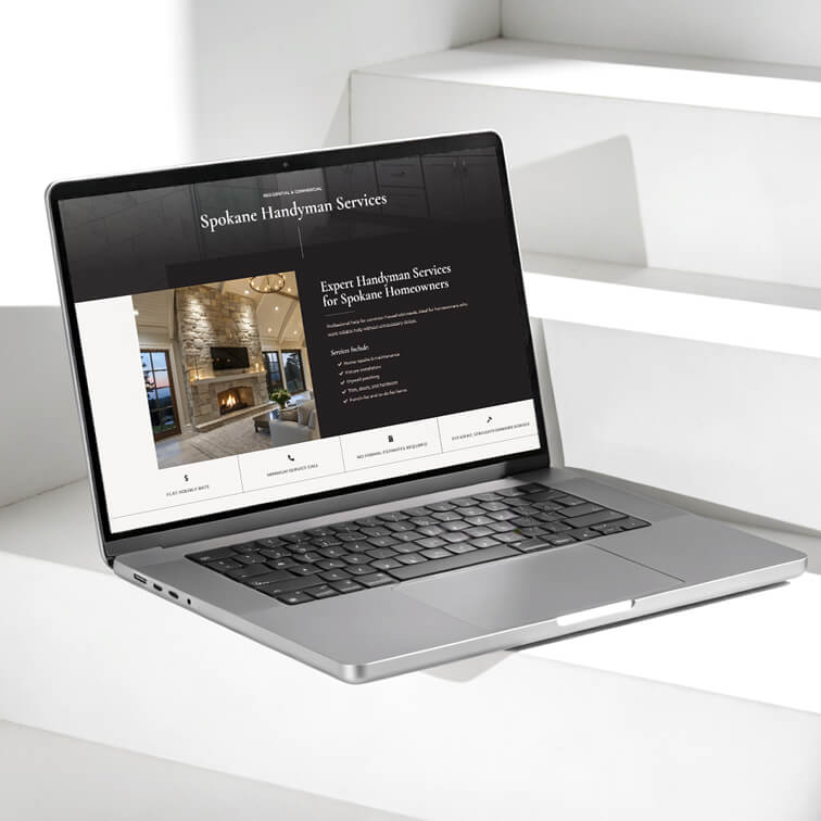 A silver laptop on white steps displays a website for Spokane Handyman Services, featuring an image of a living room and text offering expert handyman services.